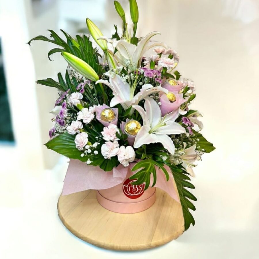 EXOTICISM, WHITE ORIENTAL LILY, (4 FERRARO ROCHER) IN FLORAL BOX.